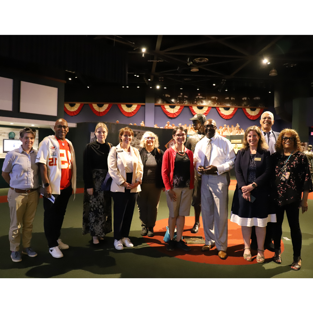 photo of NEH Chair Shelly Lowe, SHSS Dean Tamara Falicov, and others at the Negro Leagues Baseball Museum